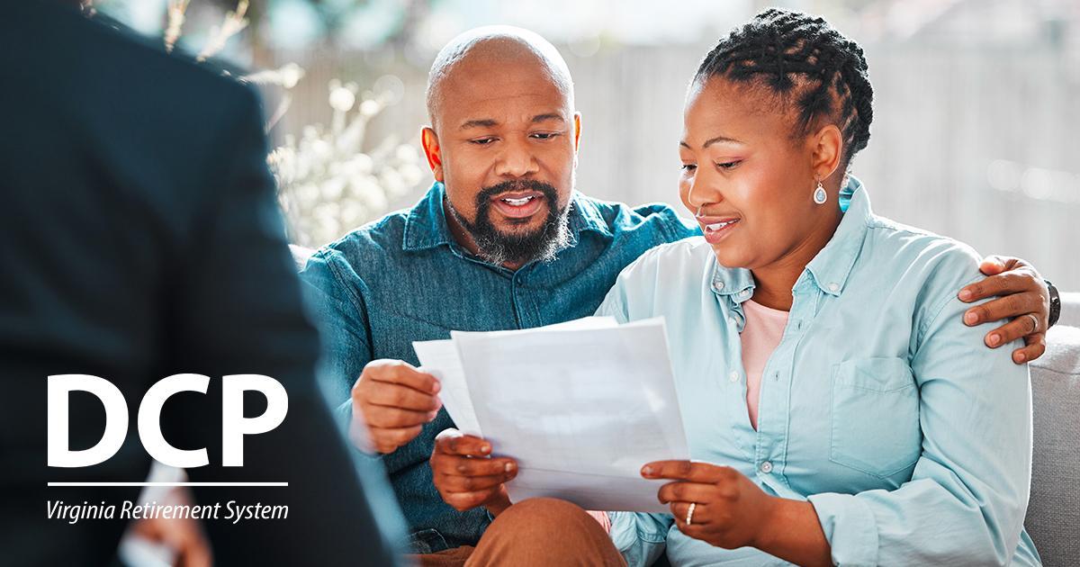 Illustrative. A mature couple review papers while seated on a couch across from their financial advisor. The DCP logo is in the lower left corner.