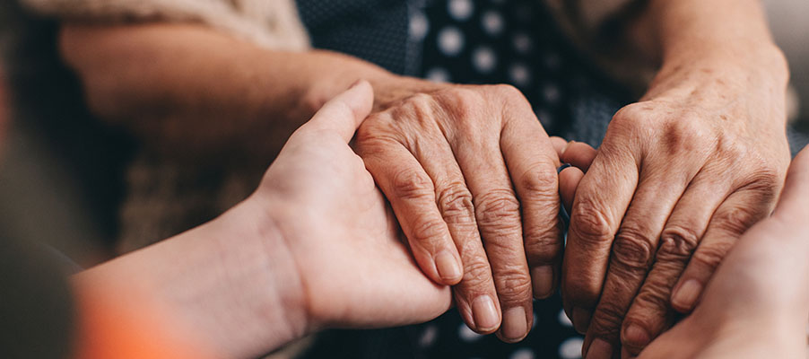 A close up of hands holding a hand