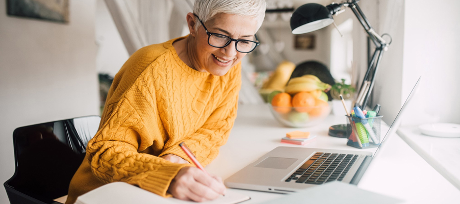 A person writing on a paper