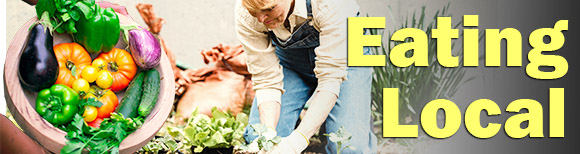 A woman plants vegetable transplants in a garden while another person shows the viewer a large bowl full of harvested vegetables. Text on the right says eating local.